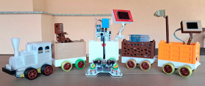 Arduino Express smart train with 3D-printed carriages, each equipped with different STEM learning tools